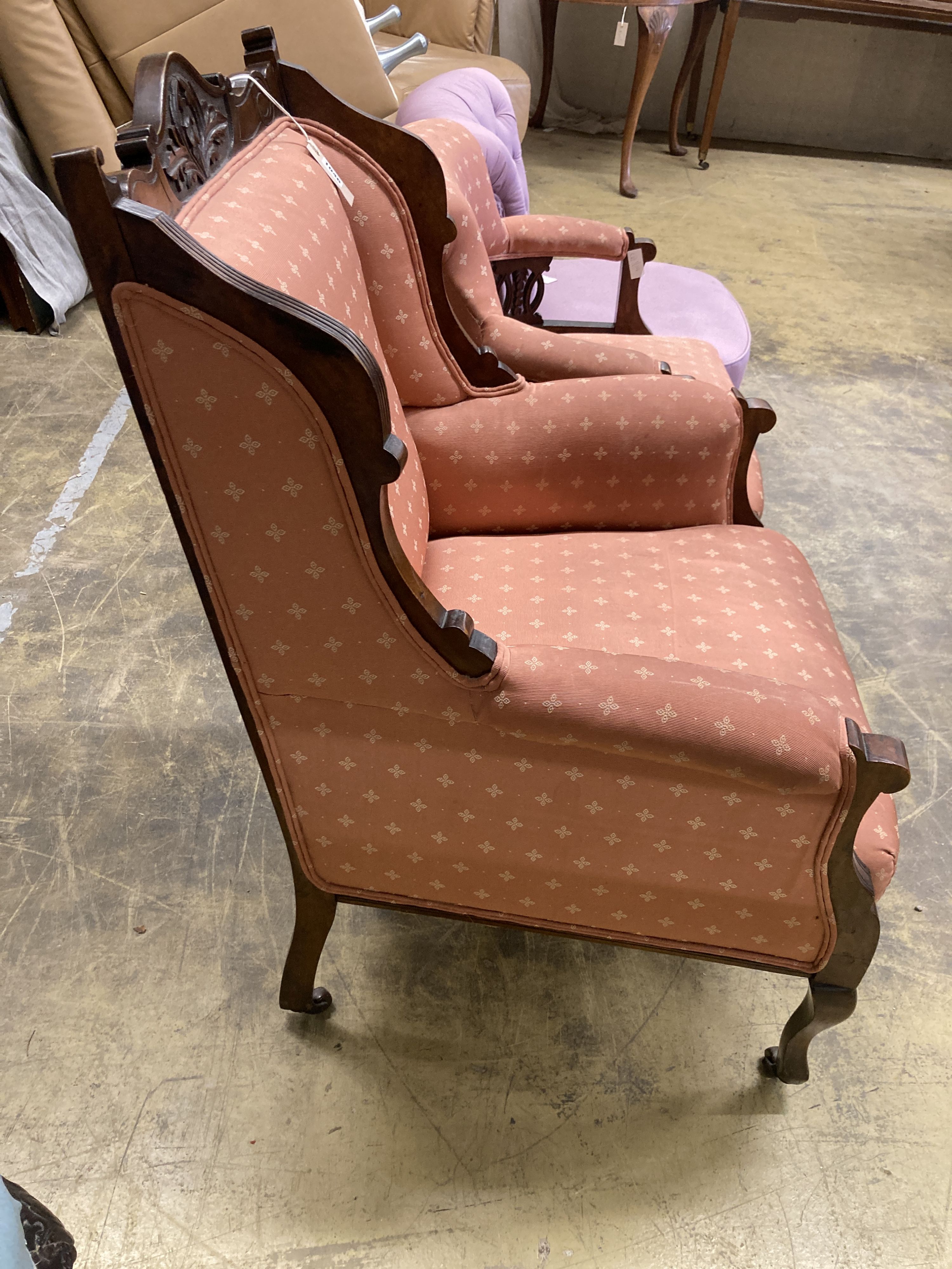 A late Victorian mahogany armchair together with a matching tub framed elbow chair
